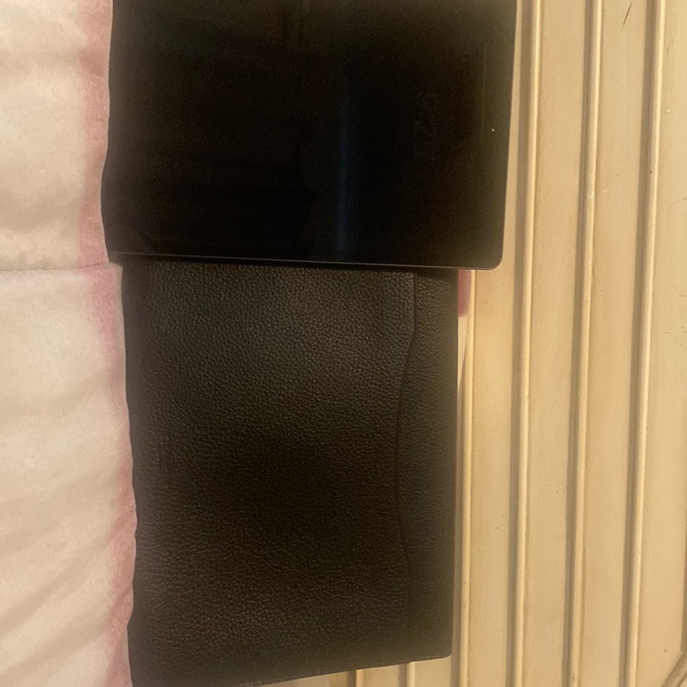 IPad 10’2 inch and Coach IPad carrying case. The IPad is 7th gen with IOS 16.5.